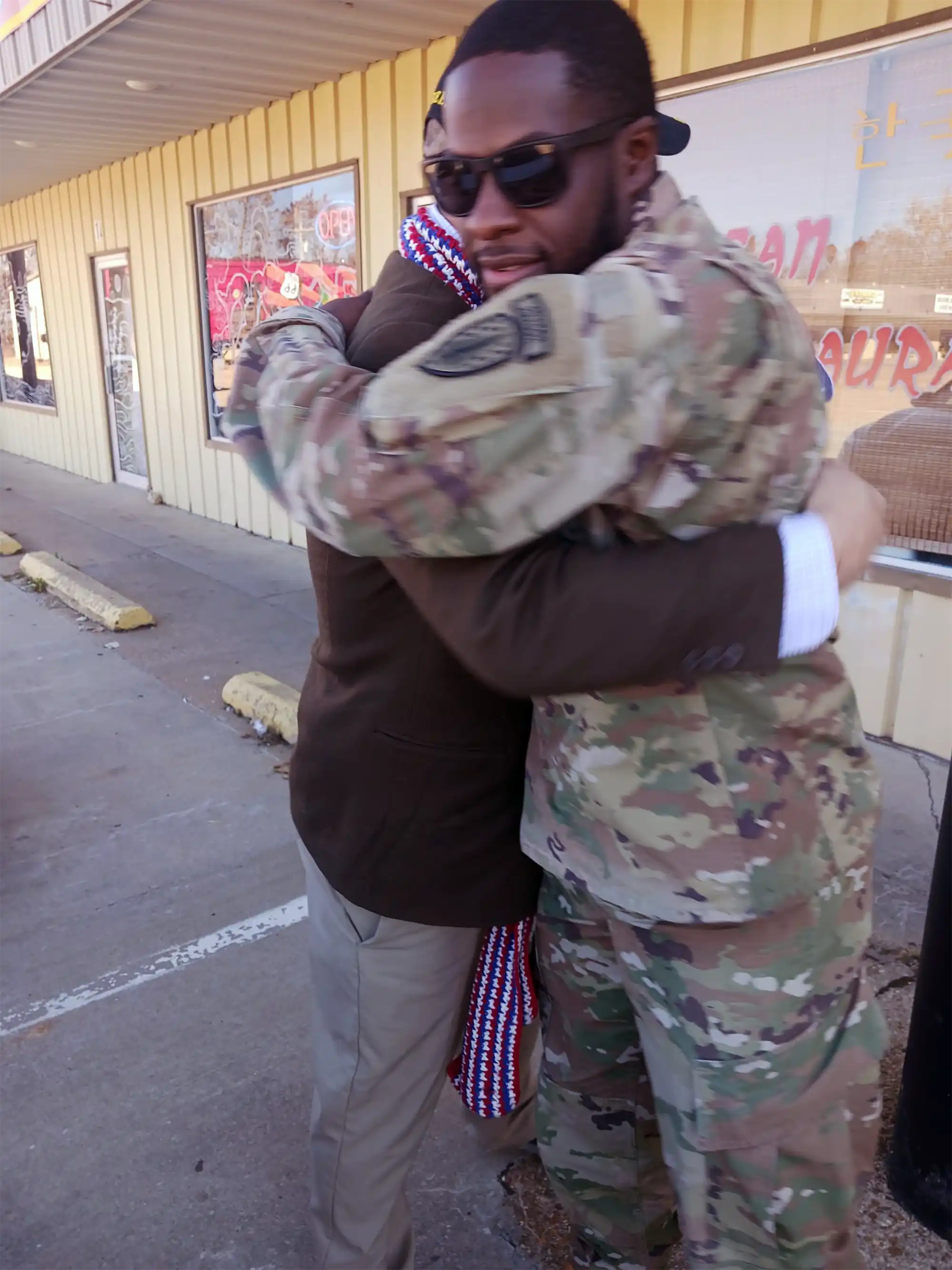 With every hug to a US soldier, Veteran David Haave supports the troops 100%, USA.